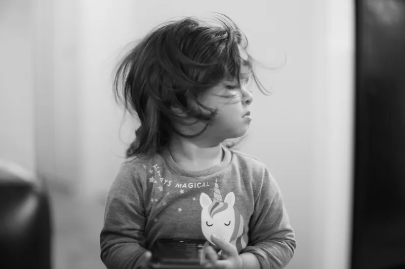 Black and white portrait of a young child looking to the side